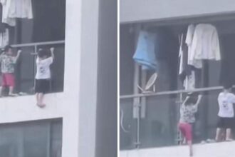 scene de groaza la etajul 13 doi copii surprinsi in afara balconului unui apartament din china 68eca3d5e2f3b